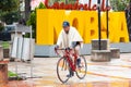 Inhabitant of the small town of Nobsa riding his bicycle wearing one of the traditional ruanas made in that town of Boyaca