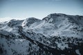 Nocky mountains in Austria getting covered in shaddow. Winter Alps during sunset. Royalty Free Stock Photo