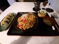 Noddle lunch with miso soup, sushi and salad