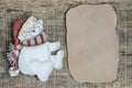 Noel background with carved bear and blank letter paper on wood