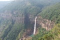 Nohkalikai falls waterfall surrounded by green cliffs