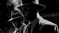 Noir-inspired scenes of money laundering, racketeering rings, black market dealings, hitmen shadows, and extortion tactics