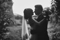 Noise and grain in the photo. black and white photo silhouette of young bride and groom. wedding day. selective focus Royalty Free Stock Photo