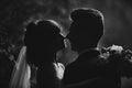 Noise and grain in the photo. black and white photo silhouette of young bride and groom. wedding day. selective focus Royalty Free Stock Photo