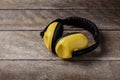 Noise reduction protective earmuffs, Standard construction safety equipment on wooden table