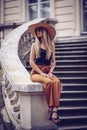 Noise. Vintage Style. Beautiful elegant woman in hat outdoor. Fa