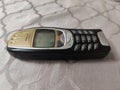 Nokia old Mobile Phone in black and gold colors, Nokia`s most popular phone launched in the 2000`s