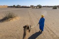 Nomad with a camel in Sahara desert