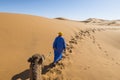 Nomad with a camel in Sahara desert