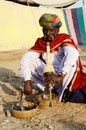 Nomad snake charmer playing pungi at camel mela,Pushkar,India Royalty Free Stock Photo