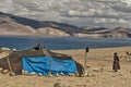 Nomadic people with goats and yaks near the high altitude lake of Tso Moriri