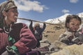 Nomadic people working various handicrafts carpets, rugs, etc. to sell in the city near the high altitude lake of Tso Moriri Royalty Free Stock Photo