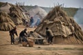 nomadic tribe constructing new tent village