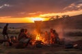 nomadic tribe cooking over open fire, with view of the sunset Royalty Free Stock Photo