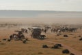 nomadic tribe traversing vast, open landscape with pack animals and carts