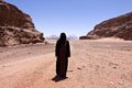 Nomadic woman with burka in wadi rum Royalty Free Stock Photo