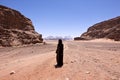 Nomadic woman with burka in wadi rum Royalty Free Stock Photo