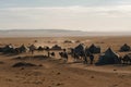 nomads crossing vast desert landscape with their camels and tents