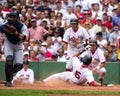 Nomar slides home safe.