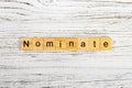 NOMINATE word made with wooden blocks concept Royalty Free Stock Photo