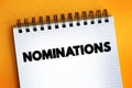 Nominations text on notepad, concept background