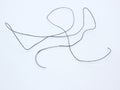 Non absorbable silk suture with needle isolated on white background Royalty Free Stock Photo