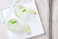 Non alcohol cold mojito cocktail with fresh lime, mint and crushed ice on a white plate Royalty Free Stock Photo