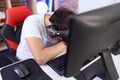 Non binary man streamer stressed using computer at gaming room