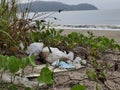 non-degradable waste. Plastic bags, plastic drinking glasses and anti-Covid masks are littered along the beautiful beach