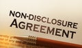 Non disclosure agreement document with pen close-up Royalty Free Stock Photo