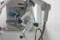 Non-invasive ventilation face mask, on background medical ventilator in ICU in hospital