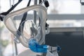 Non-invasive ventilation face mask, close up view, on background medical ventilator in ICU in hospital Royalty Free Stock Photo