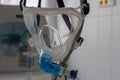 Non-invasive ventilation face mask, close up view, on background medical ventilator in ICU in hospital Royalty Free Stock Photo