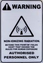 Non-ionizing radiation hazard safety area, danger warning text sign sticker label, large icon signage, isolated black triangle Royalty Free Stock Photo