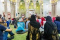 Non-Muslim guests listening a lecture from a Muslim female teacher inside of Jumeirah Mosque, the only mosque in Dubai which is