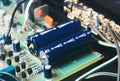 Non polarized capacitor on electronic circuit board Royalty Free Stock Photo