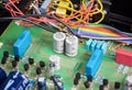 Non polarized capacitor row on electronic circuit board Royalty Free Stock Photo