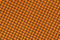 Non-stick fibreglass grill mat arranged in a diagonal position on the orange background