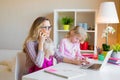 Mom with two daughters working from home Royalty Free Stock Photo
