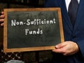 Non-Sufficient Funds phrase on the black chalkboard Royalty Free Stock Photo