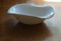 Non-symmetric empty ceramic bowl