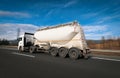 Non-Tipping silo semitrailer carrying chemical material on the highway. Truck, Tanker Chemical Delivery. Royalty Free Stock Photo