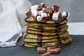 Non-traditional green sweet pancakes with chocolate