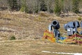 non-working snow generator on a slope without snow gear at a resort on a sunny day. Active recreation Royalty Free Stock Photo