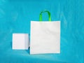 Non woven fabric grocery bags on blue background. ECO Friendly Tote promotional products shopper bags Royalty Free Stock Photo