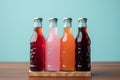 Nonalcoholic soda bottles in assorted styles, paired with a white paper box, set against a Toscha background,