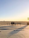 Nondescript couple sitting on a bench off the bike path off Santa Monica Beach Royalty Free Stock Photo