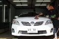 At Nong carwash, Bangkok Thailand - Logo TOYOTA on a car , staff worker hand polishing car wash in car wash