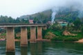 Nong Khiaw Bridge at misty morning