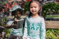 Nongkhai, Thailand - 15 January 2020: Cutie Asian girl kid wearing GAP green shirt smile.